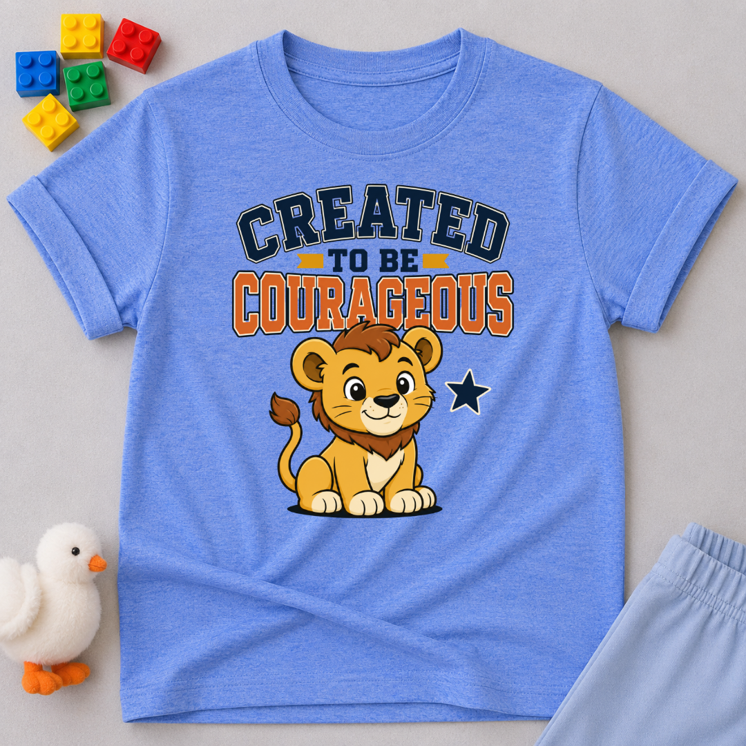Created to Be Courageous Christian kids shirt in blue featuring a smiling lion cub and faith-inspired typography
