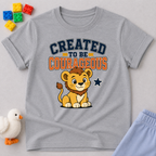 Created to Be Courageous Christian kids shirt in gray featuring a smiling lion cub and faith-inspired typography
