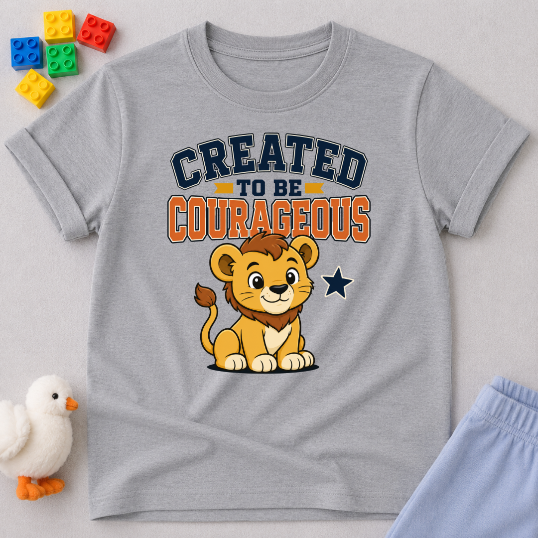 Created to Be Courageous Christian kids shirt in gray featuring a smiling lion cub and faith-inspired typography
