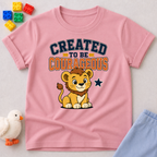 Created to Be Courageous Christian kids shirt in pink featuring a smiling lion cub and faith-inspired typography
