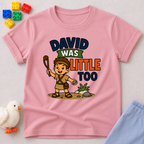 David Was Little Too Christian kids shirt in pink featuring young David holding his sling

