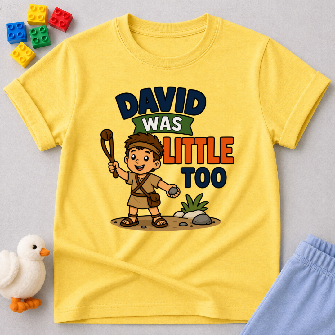 David Was Little Too Christian kids shirt in yellow featuring young David holding his sling
