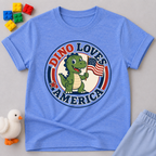 Dino Loves America Shirt Christian kids shirt in blue featuring a dinosaur holding an American flag
