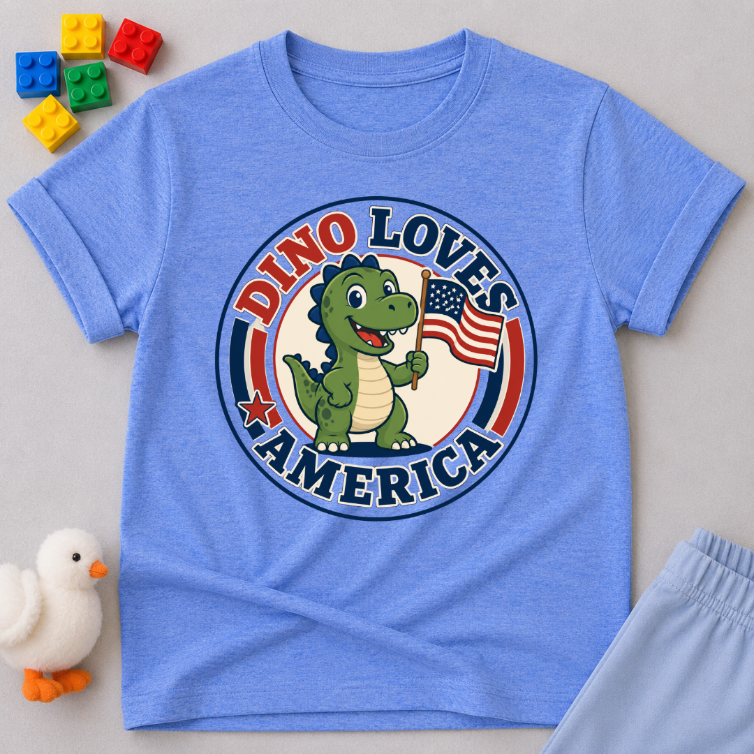 Dino Loves America Shirt Christian kids shirt in blue featuring a dinosaur holding an American flag
