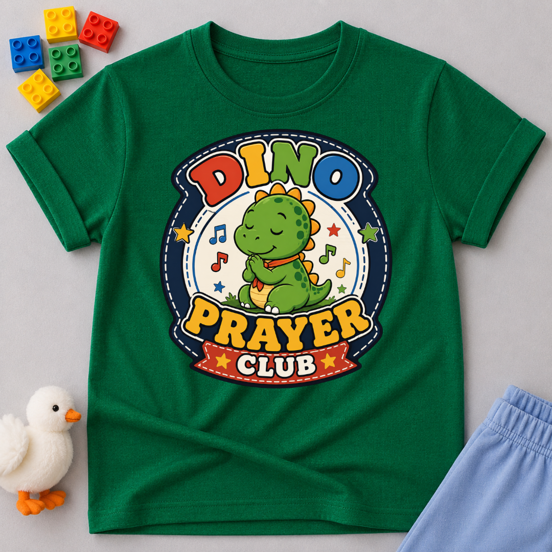 Dino Prayer Club Christian kids shirt in green featuring a praying dinosaur with colorful lettering
