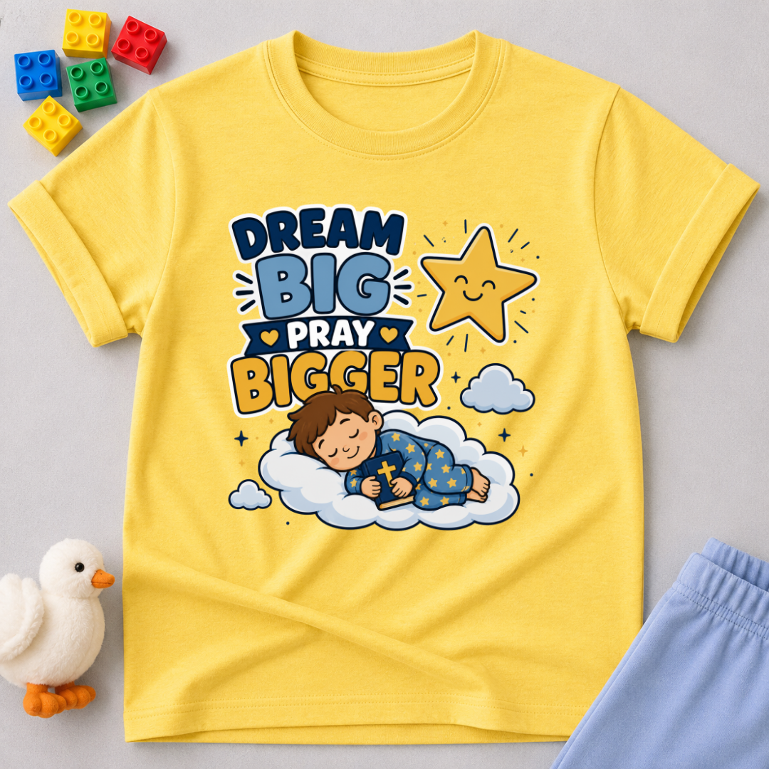 Dream Big Pray Bigger Christian kids shirt in yellow featuring a sleeping child and star
