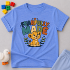 Fearfully Made Lion Christian kids shirt in blue featuring a smiling lion cub with leafy accents
