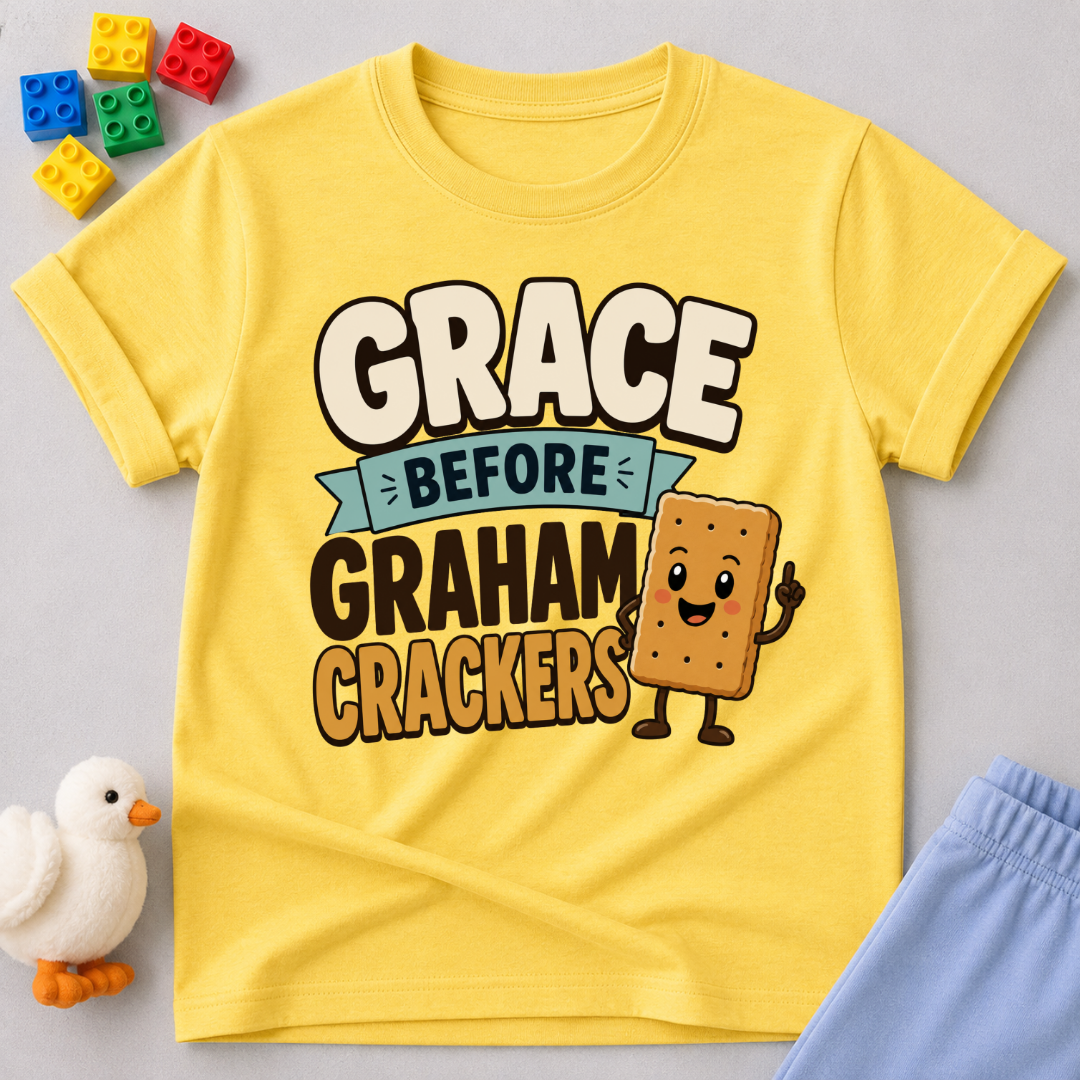 Grace Before Graham Crackers Christian kids shirt in yellow featuring a smiling graham cracker
