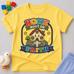 Home Built on Faith Christian kids shirt in yellow featuring a family home with faith-inspired artwork
