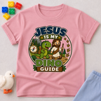 Jesus Is My Dino Guide Christian kids shirt in pink featuring Jesus with friendly dinosaurs
