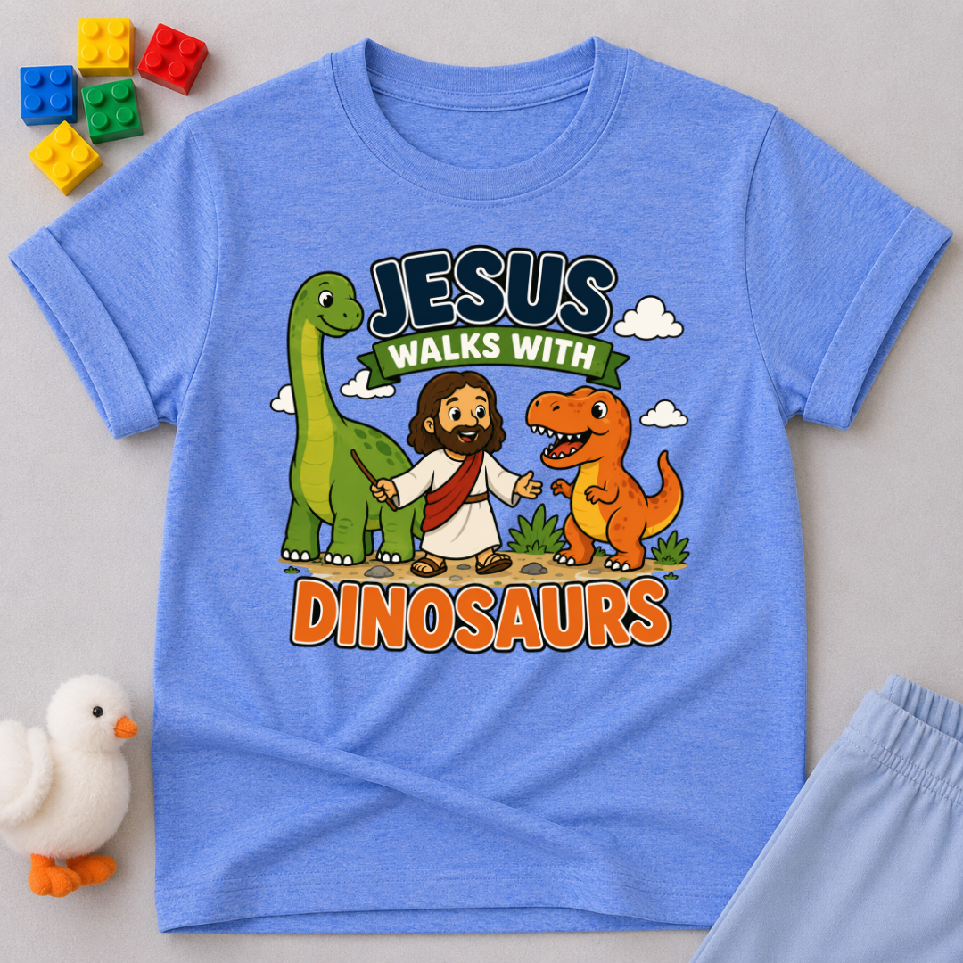 Jesus Walks with Dinosaurs Christian kids shirt in blue featuring Jesus walking alongside friendly dinosaurs
