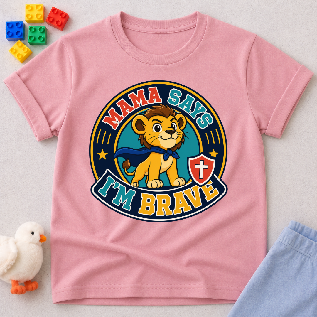 Mama Says I'm Brave Lion Christian kids shirt in pink featuring a brave lion with a shield
