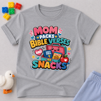 Mom Packs Bible Verses and Snacks Christian kids shirt in gray featuring a lunchbox, Bible, and snacks
