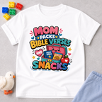 Mom Packs Bible Verses and Snacks Christian kids shirt in white featuring a lunchbox, Bible, and snacks
