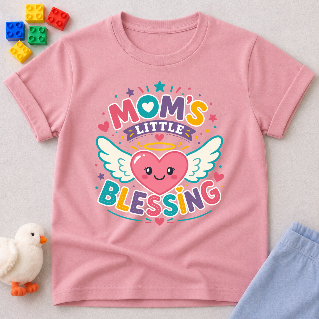 Mom's Little Blessing Heart Christian kids shirt in pink featuring a smiling heart with angel wings

