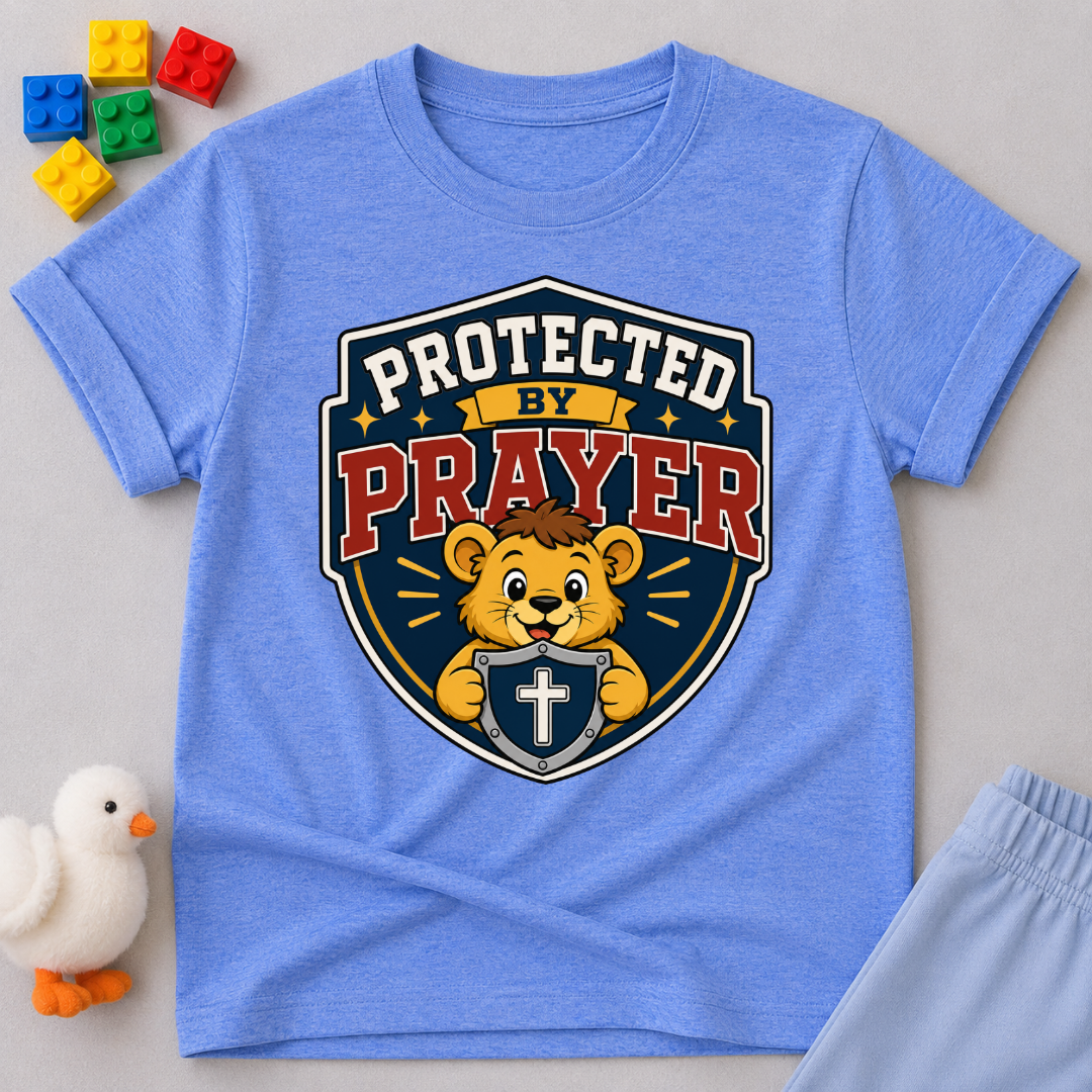 Protected by Prayer Shield Christian kids shirt in blue featuring a lion inside a protective shield
