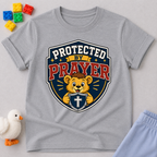 Protected by Prayer Shield Christian kids shirt in gray featuring a lion inside a protective shield
