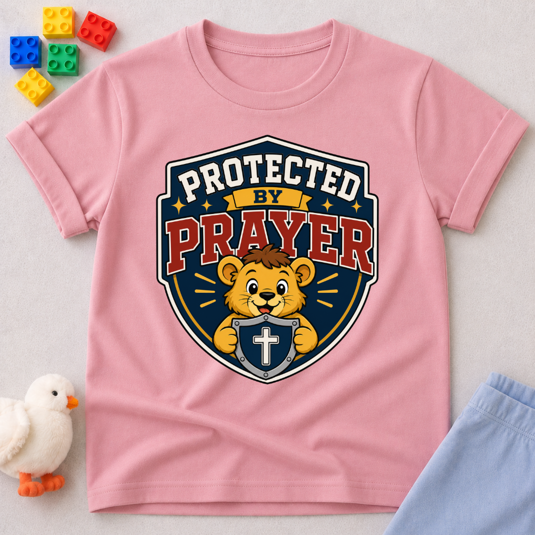 Protected by Prayer Shield Christian kids shirt in pink featuring a lion inside a protective shield
