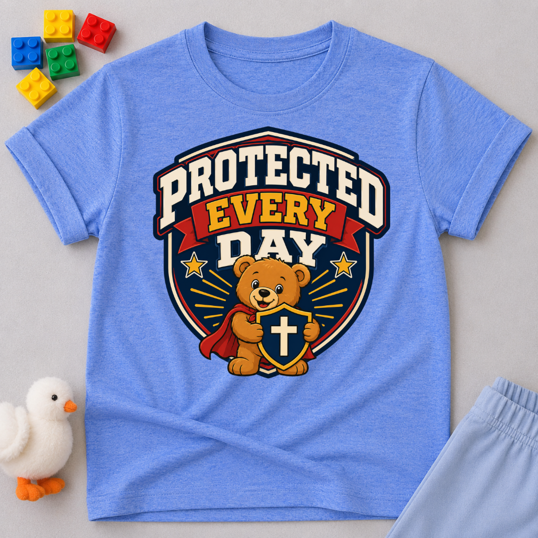 Protected Every Day Christian kids shirt in blue featuring a lion inside a protective shield
