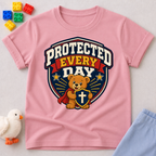 Protected Every Day Christian kids shirt in pink featuring a lion inside a protective shield
