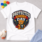 Protected Every Day Christian kids shirt in white featuring a lion inside a protective shield
