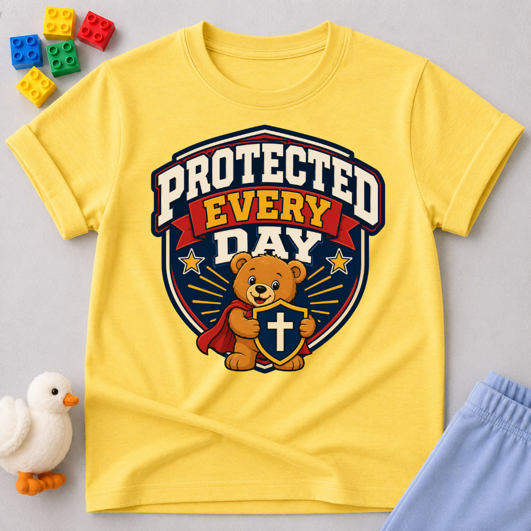 Protected Every Day Christian kids shirt in yellow featuring a lion inside a protective shield
