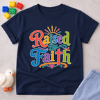 Raised by Faith Typography Christian kids shirt in navy featuring colorful faith-inspired lettering

