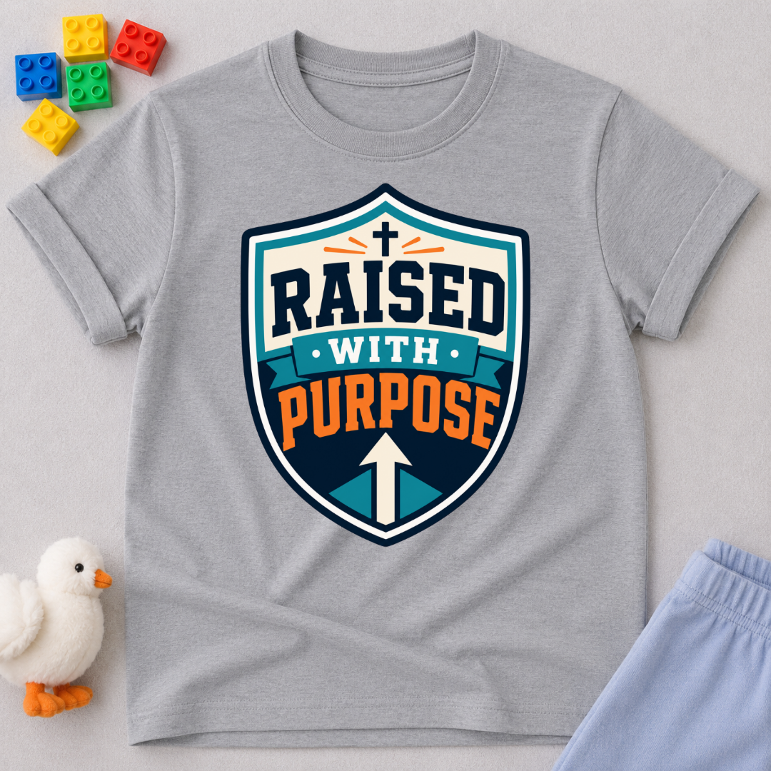 Raised with Purpose Badge Christian kids shirt in gray featuring a bold shield emblem
