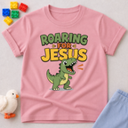 Roaring for Jesus Dino Christian kids shirt in pink featuring a happy roaring dinosaur and Christian message
