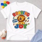 Roaring with Joy Christian kids shirt in white featuring a happy lion singing with musical notes

