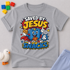 Saved by Jesus and Snacks Christian kids shirt in gray featuring a smiling superhero snack character
