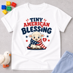 Tiny American Blessing Lamb Shirt Christian kids shirt in white featuring a patriotic lamb wrapped in an American flag
