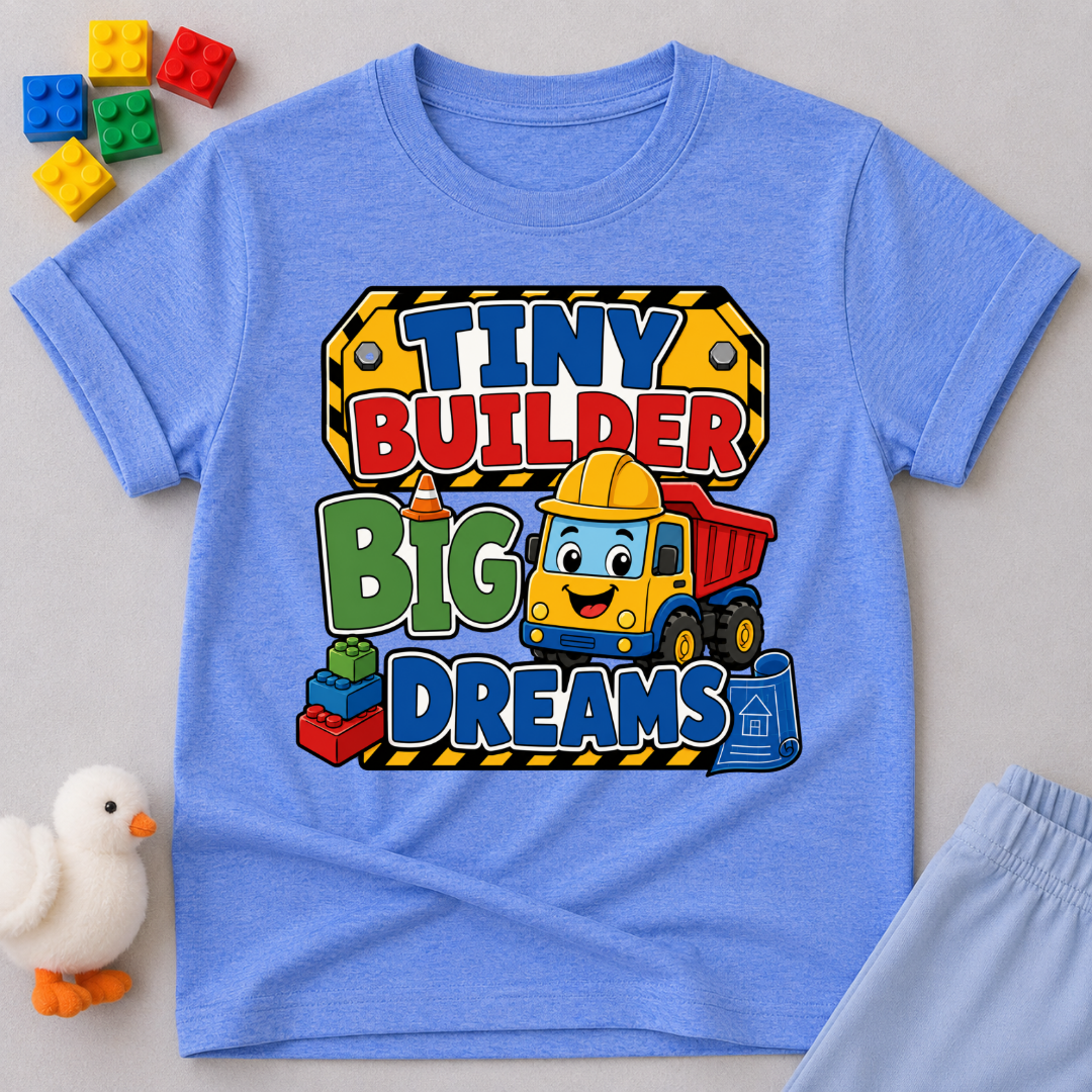 Tiny Builder Big Dreams Christian kids shirt in blue featuring a cheerful construction vehicle
