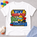 Tiny Builder Big Dreams Christian kids shirt in white featuring a cheerful construction vehicle
