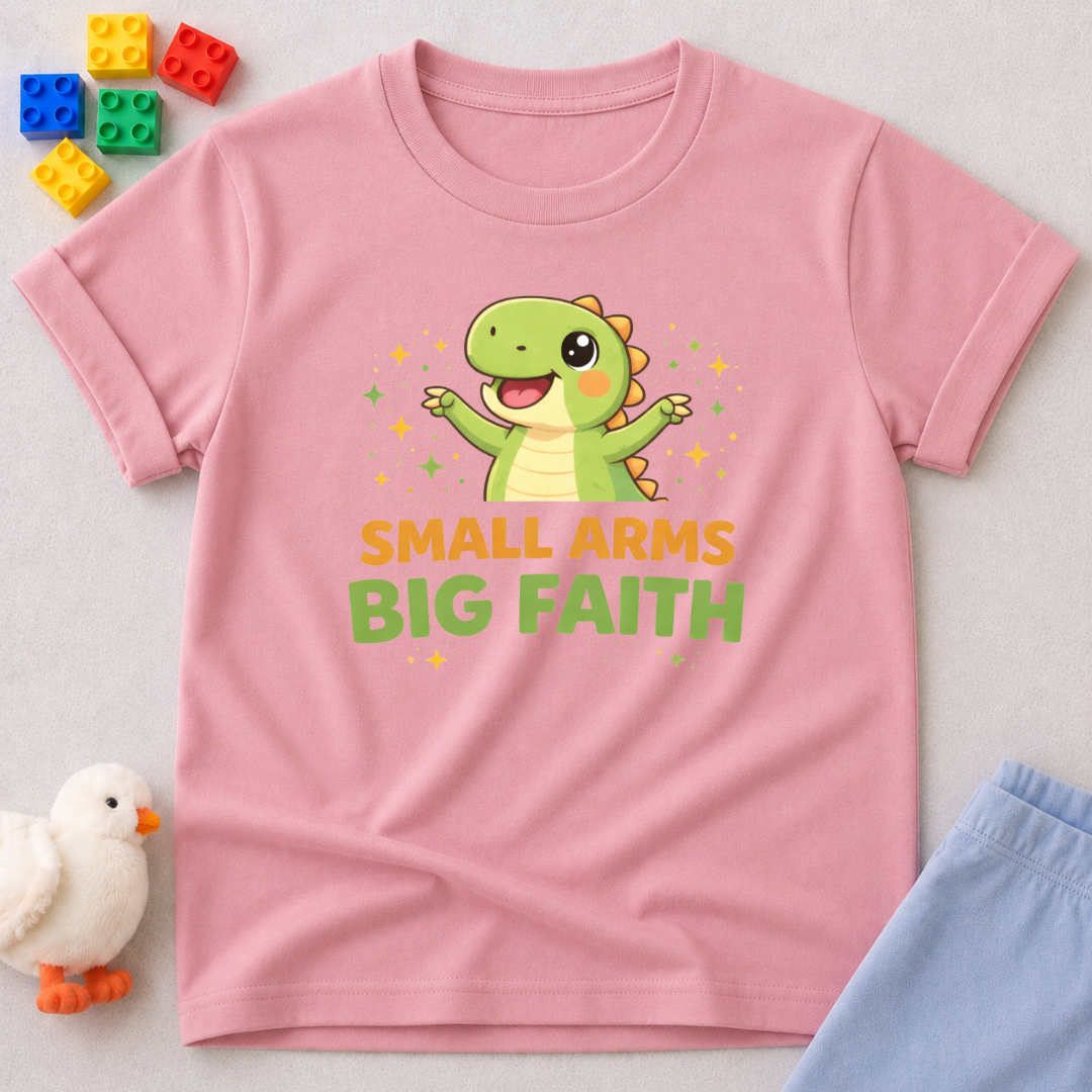 Tiny Dino Big Faith Christian kids shirt in Pink featuring a cute dinosaur and faith-inspired message