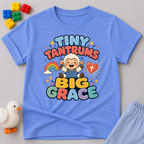 Tiny Tantrums Big Grace Christian kids shirt in blue featuring a smiling child and heart

