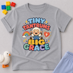 Tiny Tantrums Big Grace Christian kids shirt in gray featuring a smiling child and heart
