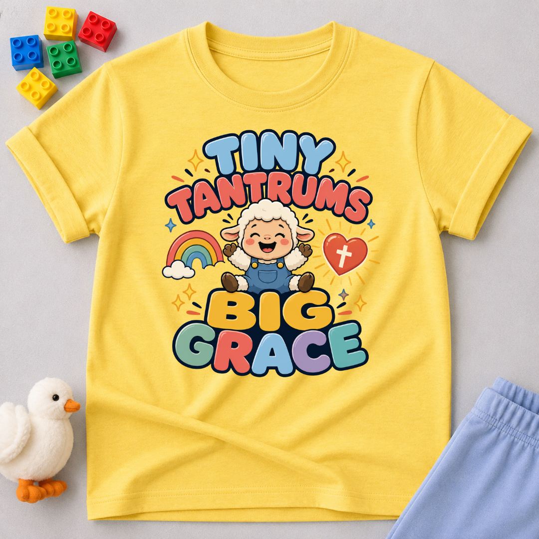 Tiny Tantrums Big Grace Christian kids shirt in yellow featuring a smiling child and heart
